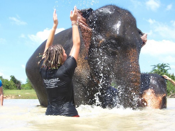 They are giving Fah Sai the best bath of her life; that just looks so refreshing!