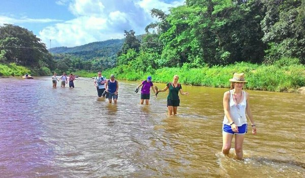 The overnight guests heading back to the park and refreshing by walking in the river